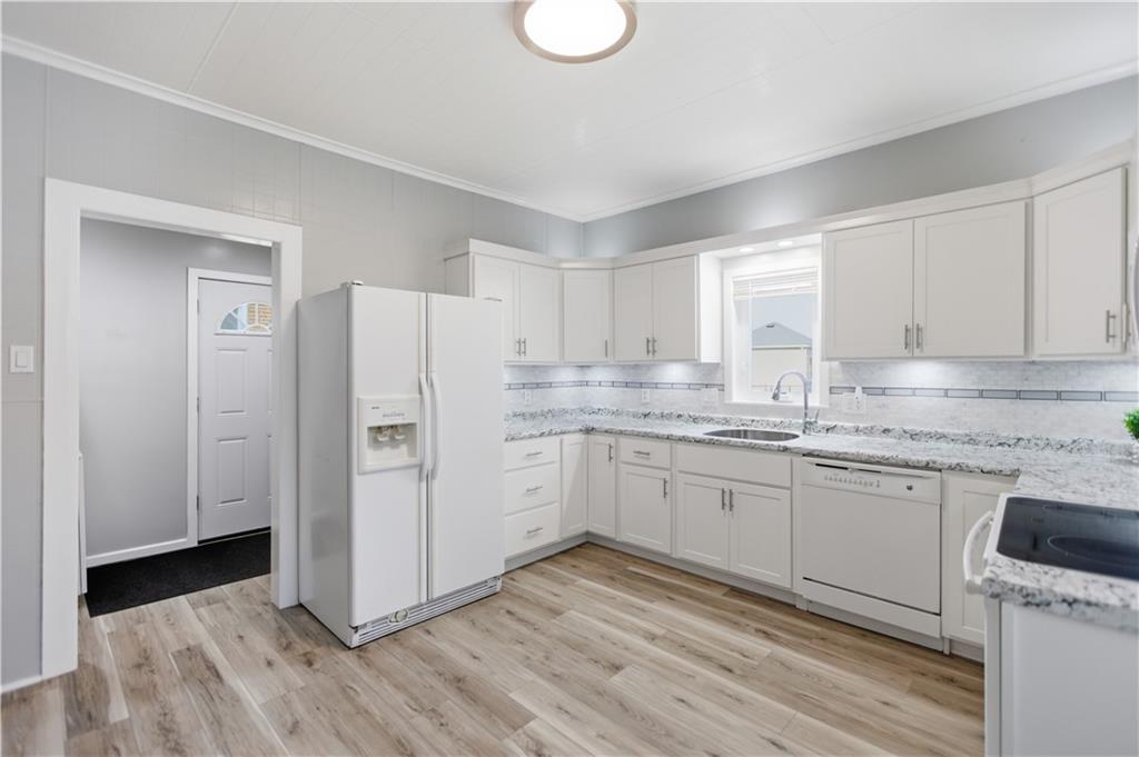 715 5th Street New Brighton, PA 15066 - Photo 12 of 30 a kitchen with granite countertop white cabinets and white appliances