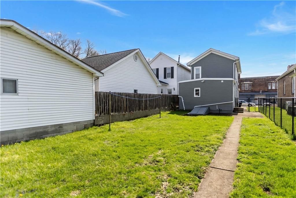 715 5th Street New Brighton, PA 15066 - Photo 25 of 30 a view of a house with a backyard