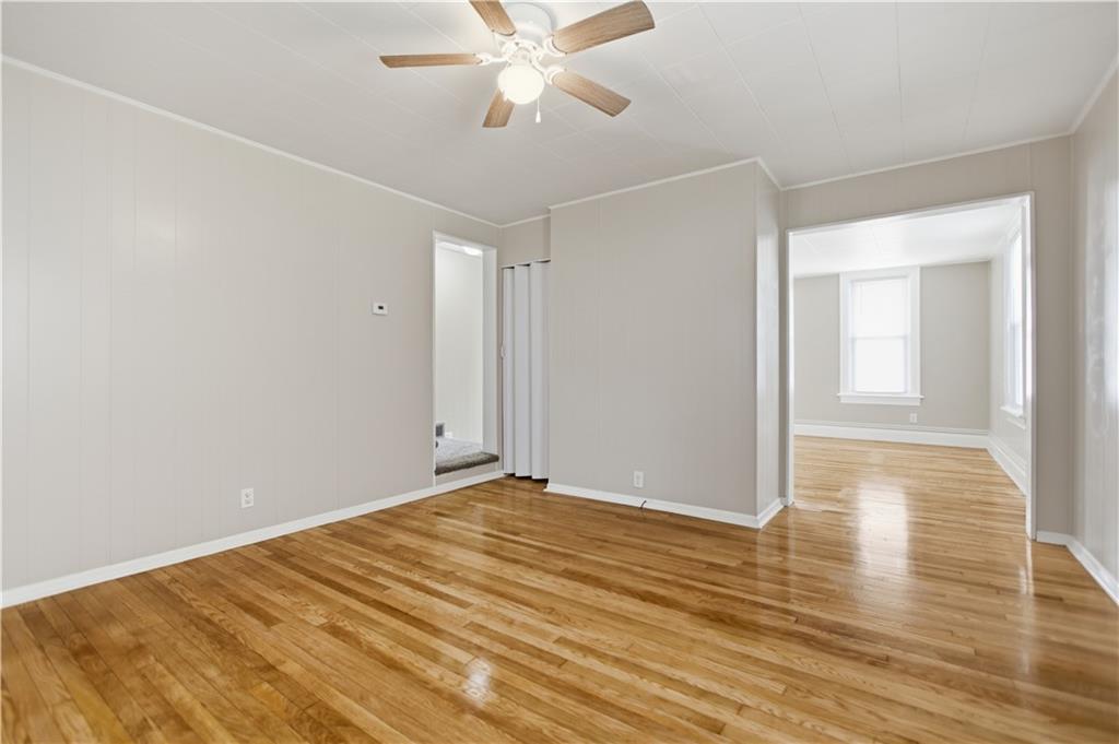 715 5th Street New Brighton, PA 15066 - Photo 9 of 30 a view of an empty room with wooden floor