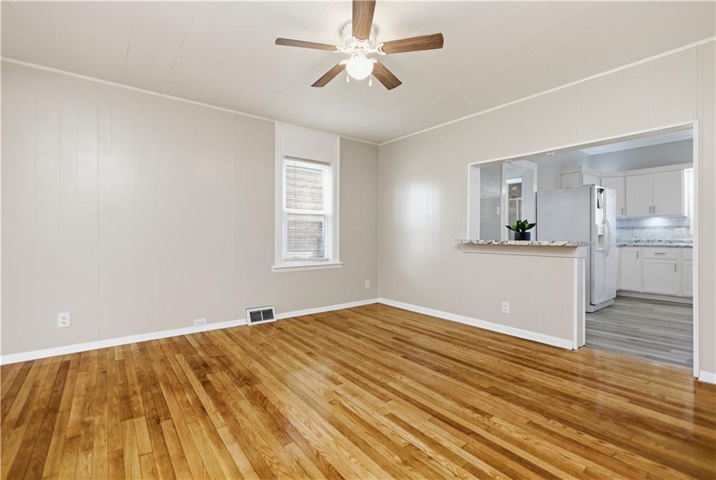 715 5th Street New Brighton, PA 15066 - Photo 10 of 30 a view of empty room with wooden floor and fan
