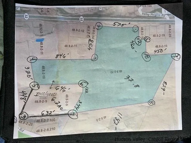 a view of a garden with a house