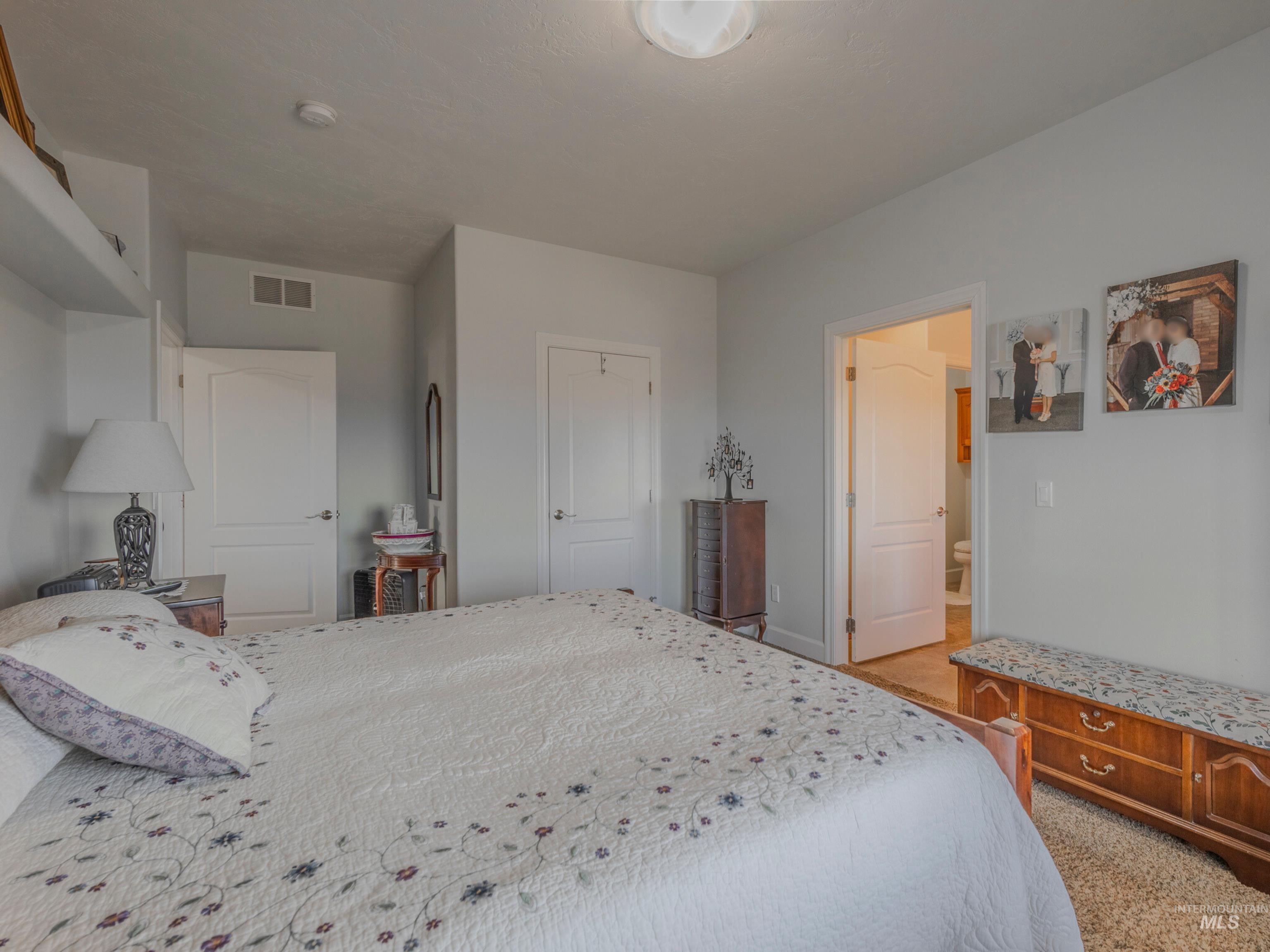 659 Reservation Line Road Cottonwood, ID 83522 - Photo 23 of 50 Bedroom with light carpet and a closet