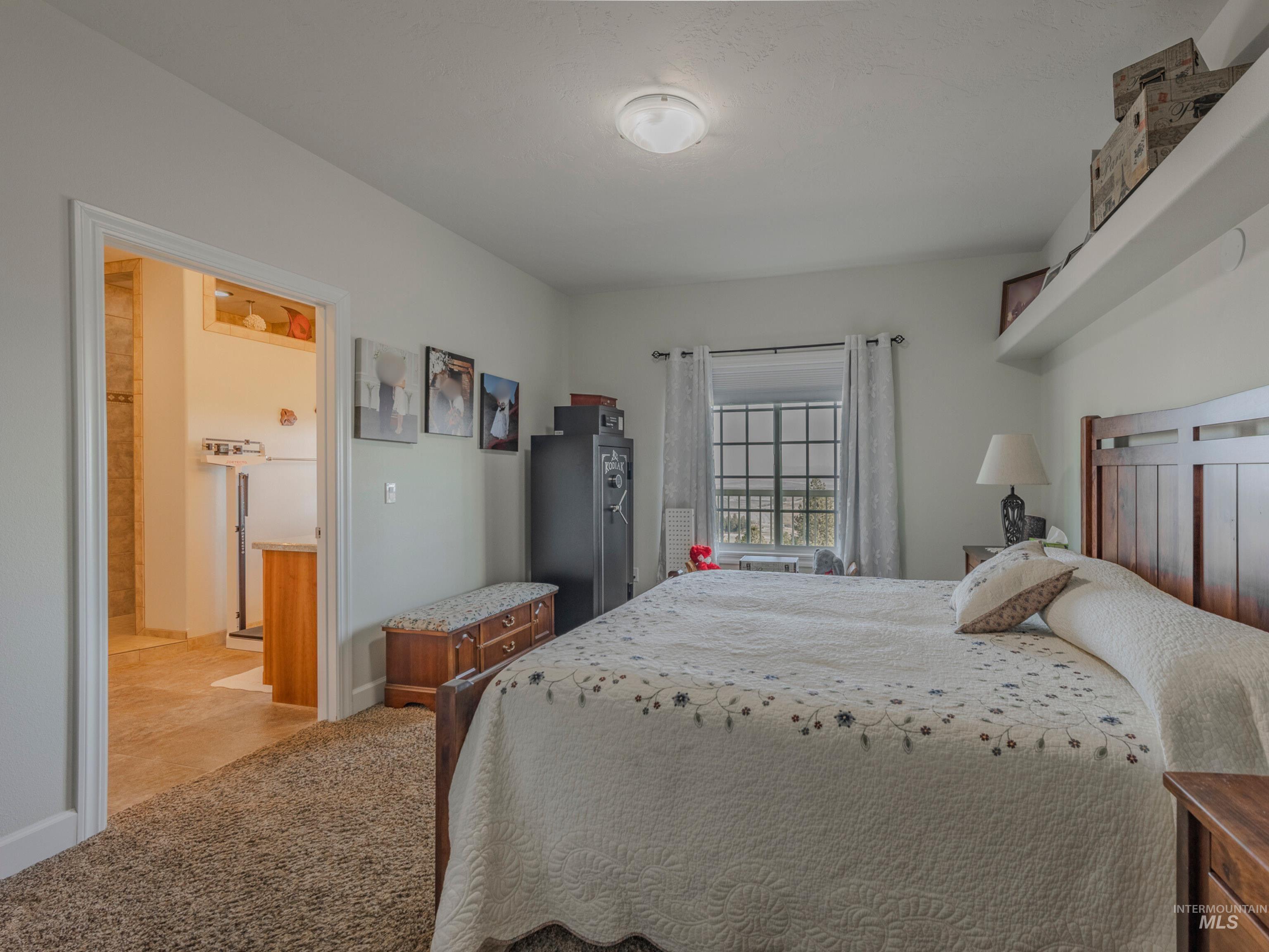 659 Reservation Line Road Cottonwood, ID 83522 - Photo 24 of 50 Bedroom with light carpet and baseboards