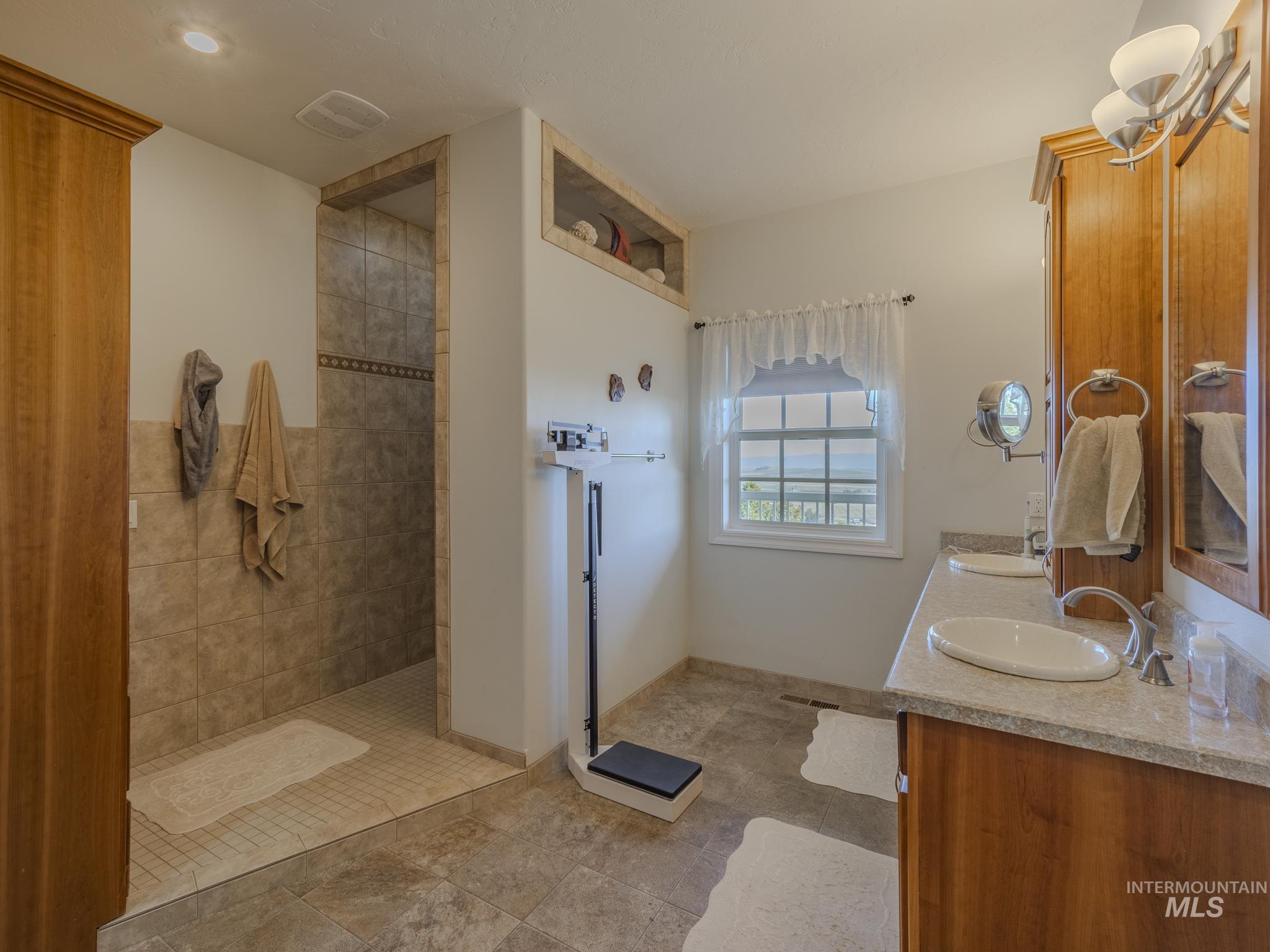 659 Reservation Line Road Cottonwood, ID 83522 - Photo 26 of 50 Full bath featuring double vanity and walk in shower