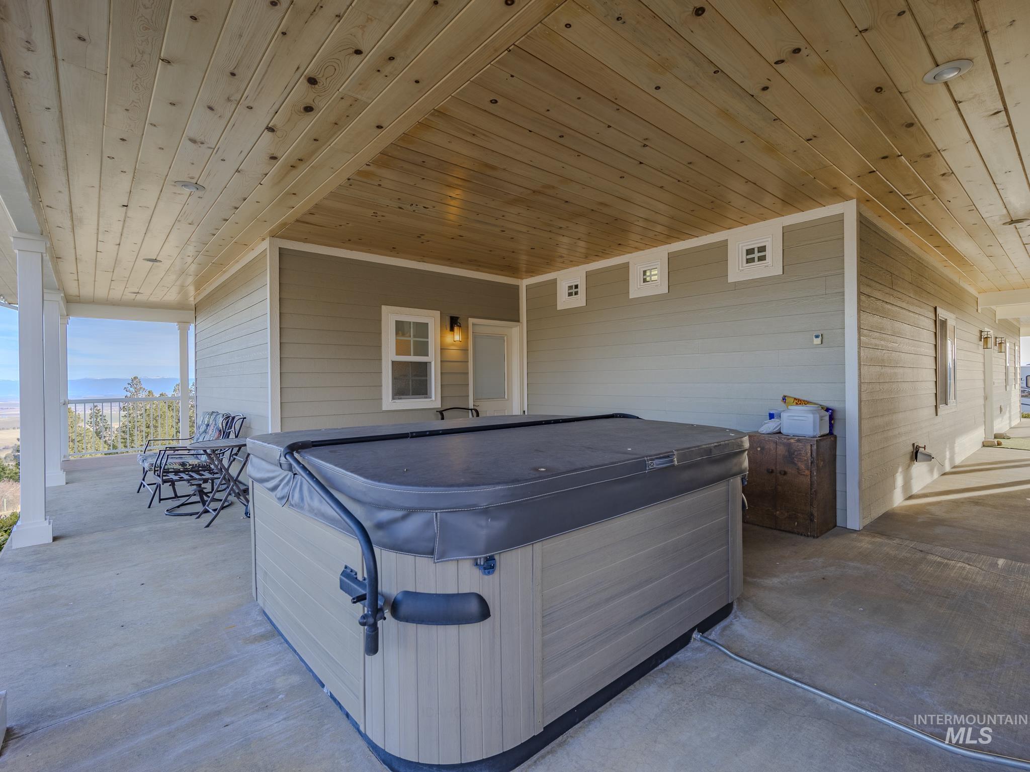 659 Reservation Line Road Cottonwood, ID 83522 - Photo 45 of 50 View of patio / terrace featuring a hot tub