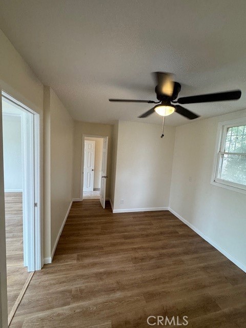 11220 Concert Street El Monte, CA 91731 - Photo 5 of 11 a view of empty room with wooden floor