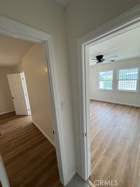 11220 Concert Street El Monte, CA 91731 - Photo 6 of 11 a view of a hallway with wooden floor and a living room