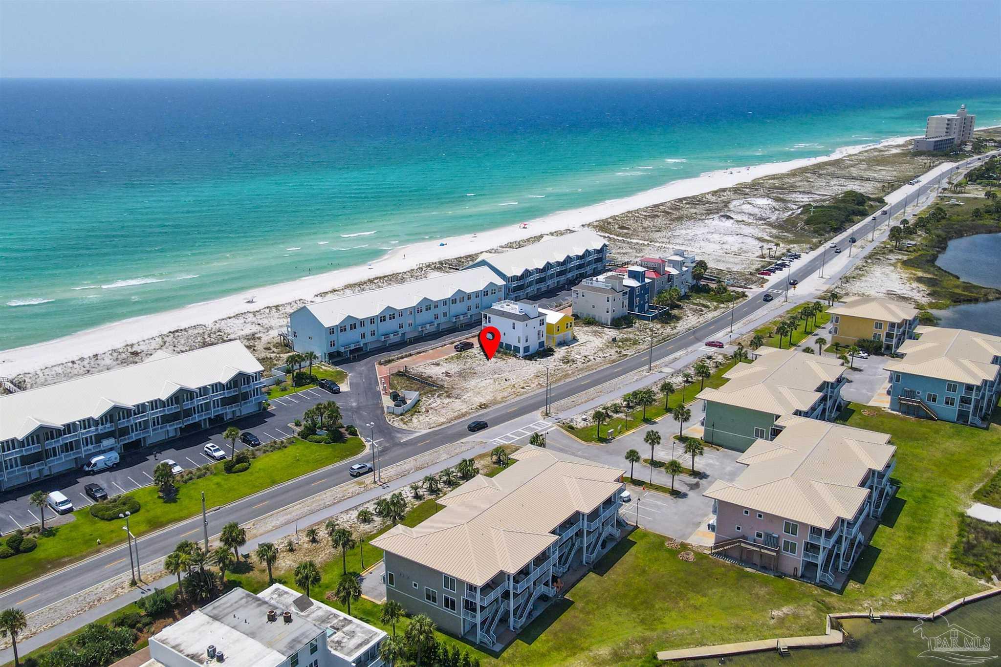 533 Fort Pickens Road Pensacola Beach, FL 32561 - Photo 2 of 32 an aerial view of a house with a garden