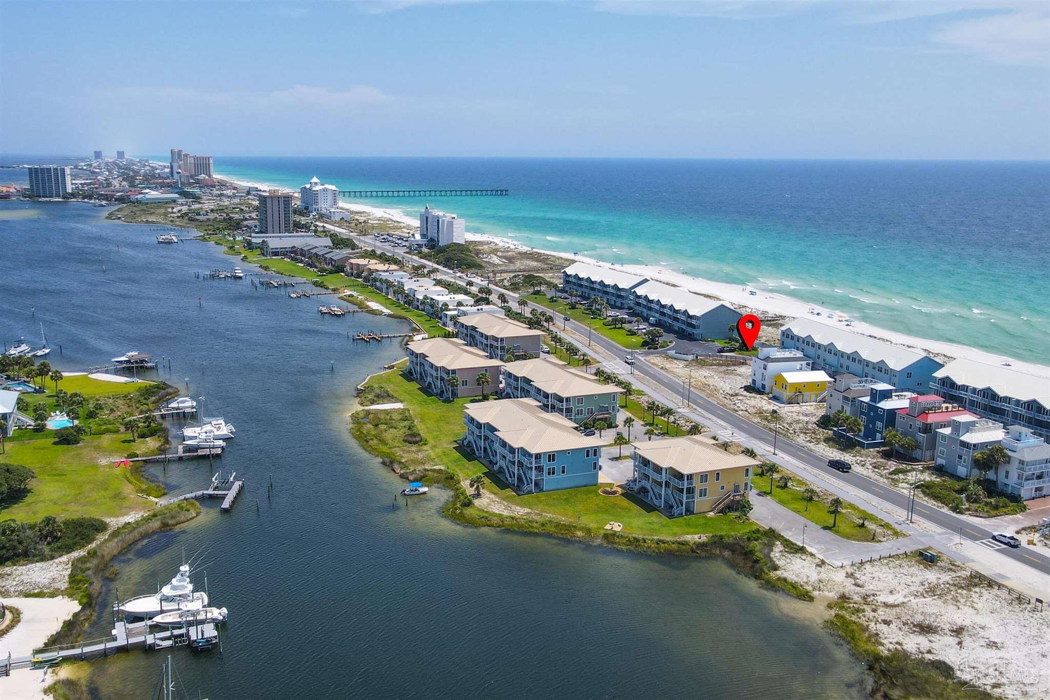533 Fort Pickens Road Pensacola Beach, FL 32561 - Photo 4 of 22 an aerial view of a house a yard swimming pool and outdoor seating