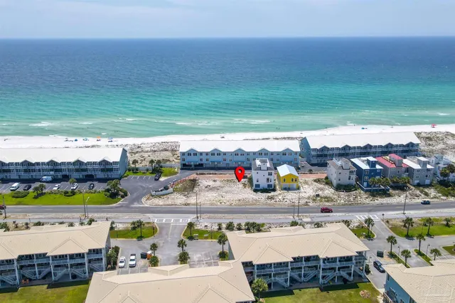 a view of swimming pool with outdoor seating and a shower