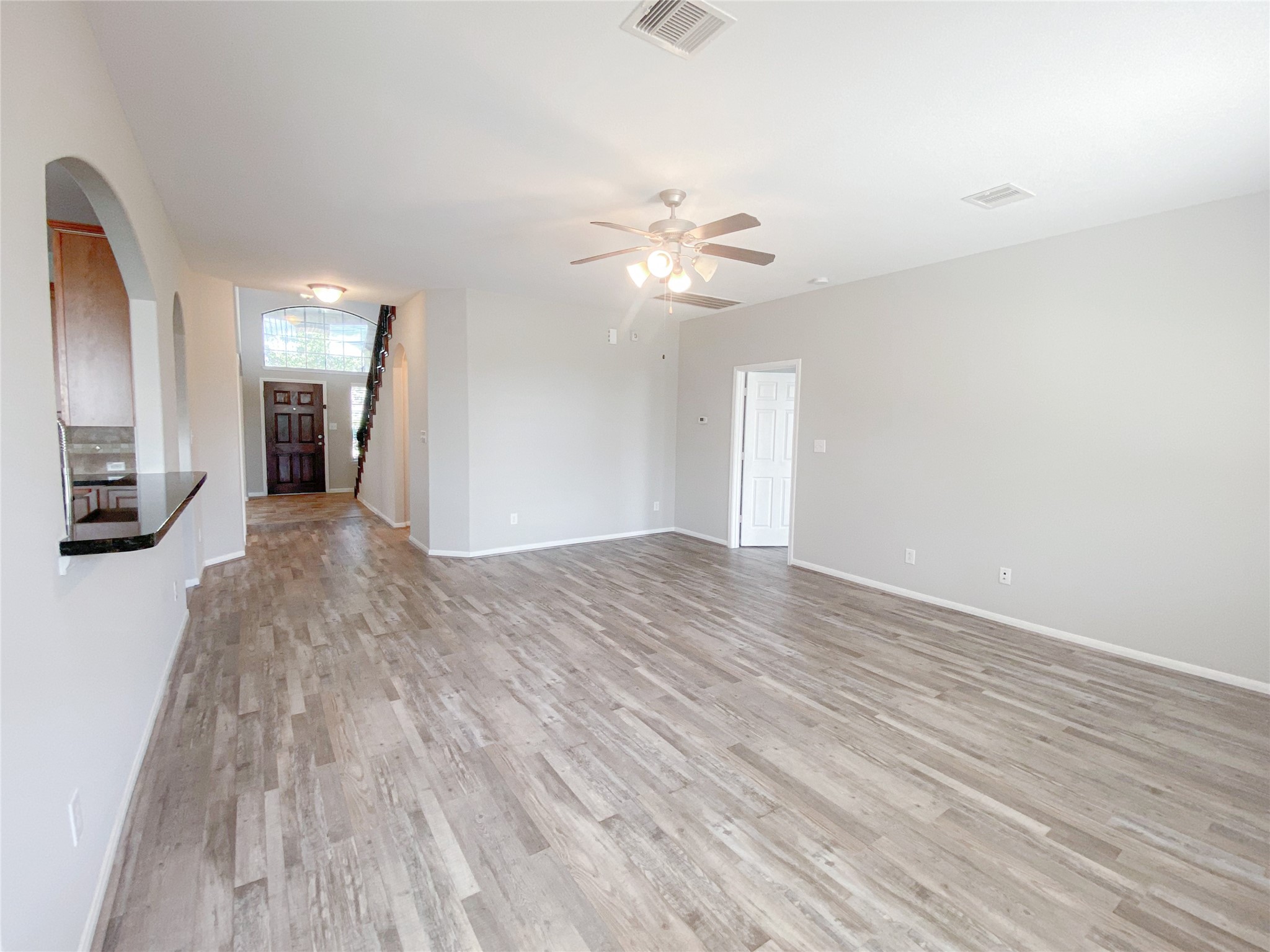 6227 Carnaby Lane Rosenberg, TX 77471 - Photo 8 of 30 Spacious family room with newly installed wood-imitation flooring and new paint