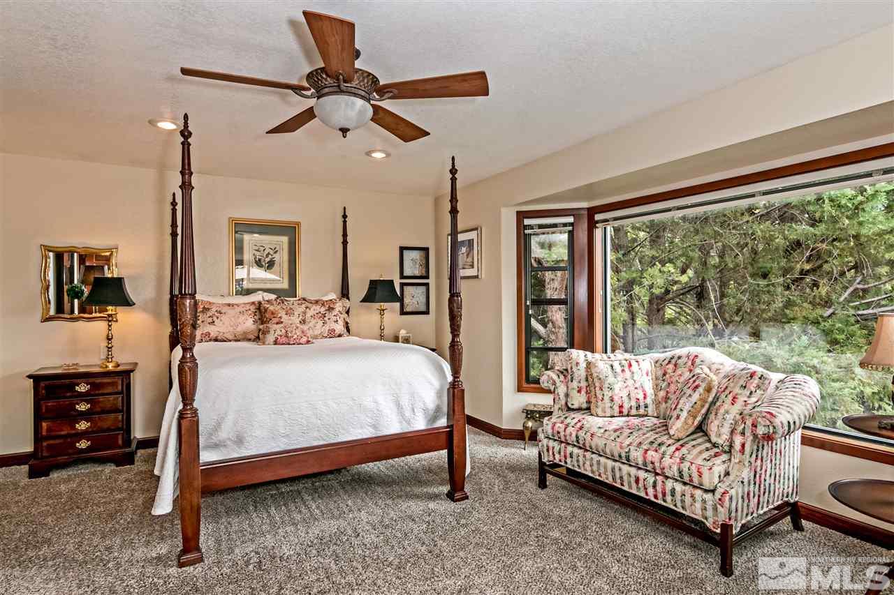 2275 Pennswood Way Reno, NV 89509 - Photo 13 of 33 a bedroom with a bed couch and window