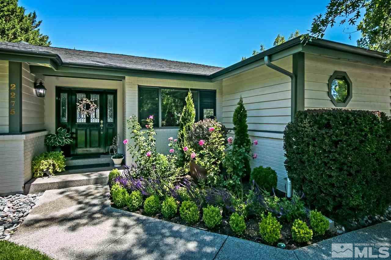 2275 Pennswood Way Reno, NV 89509 - Photo 2 of 33 a front view of a house with garden
