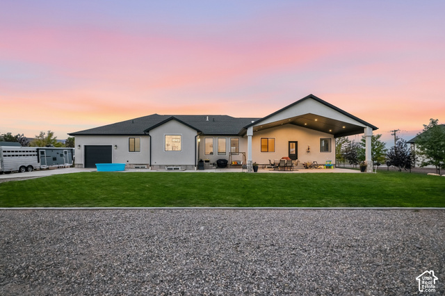 244 East Sevier River Road Central Valley, UT 84754 - Photo 2 of 66 Single-story residence featuring a covered patio, expansive lawn, and a two-car garage