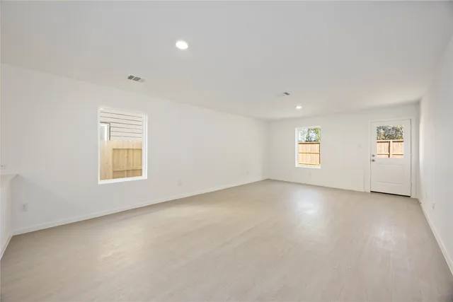 an empty room with windows