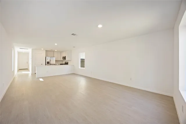 a view of a kitchen with a sink and cabinets