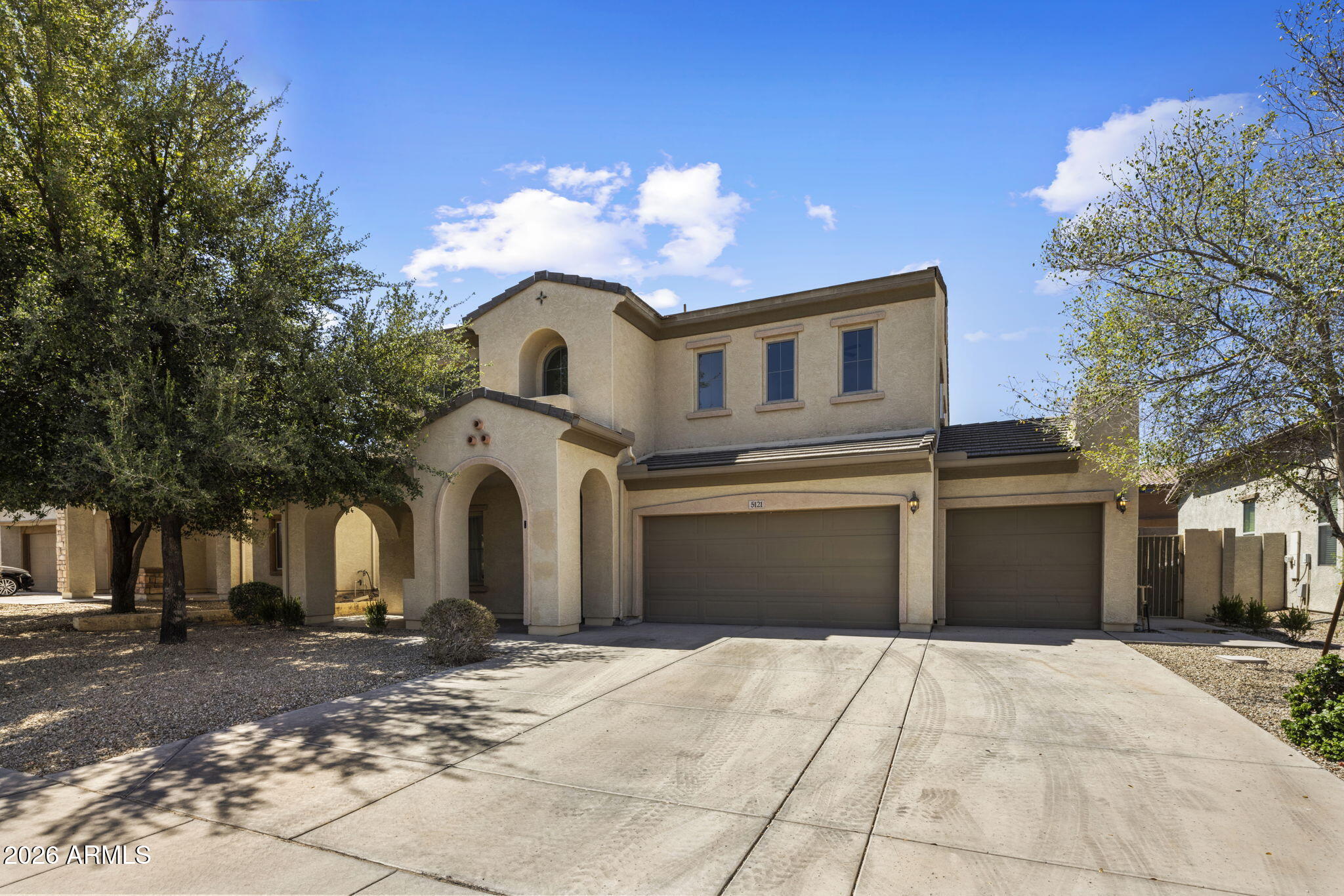 5121 West Beverly Road Laveen, AZ 85339 - Photo 32 of 32 a front view of a house with a yard and garage