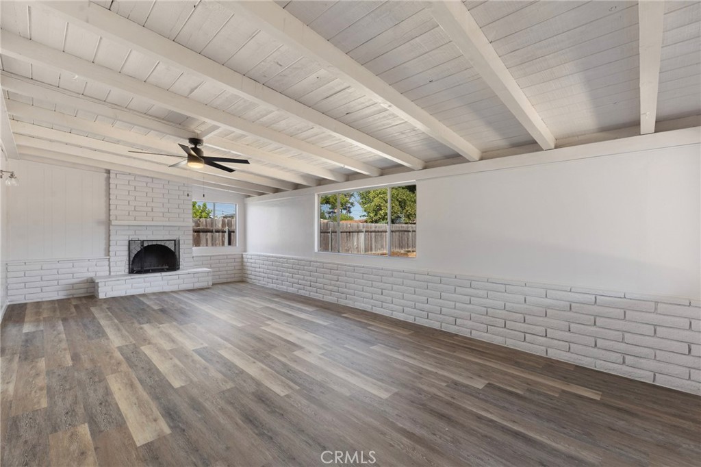 8737 Rhodes Court Santee, CA 92071 - Photo 12 of 30 a view of empty room with fireplace and wooden floor