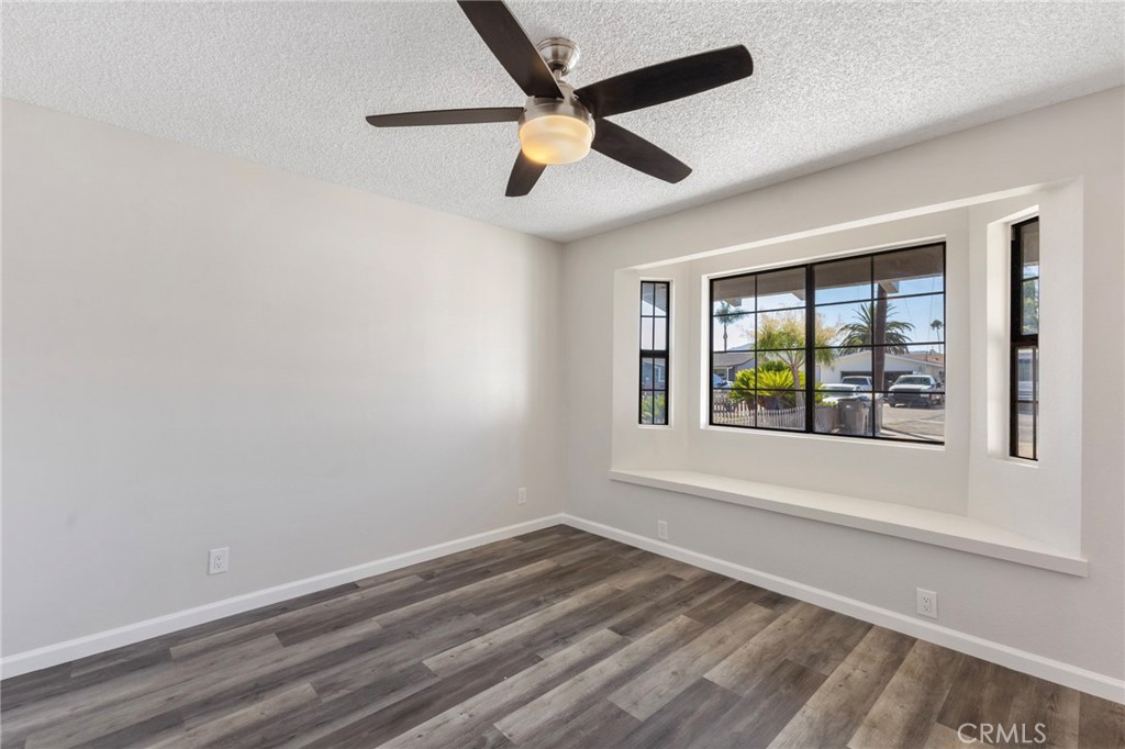 8737 Rhodes Court Santee, CA 92071 - Photo 15 of 30 an empty room with a window and ceiling fan