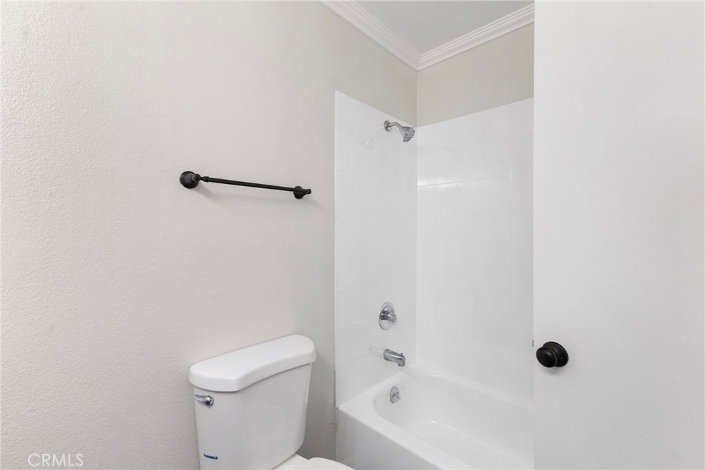 8737 Rhodes Court Santee, CA 92071 - Photo 24 of 30 a bathroom with a bathtub and a toilet