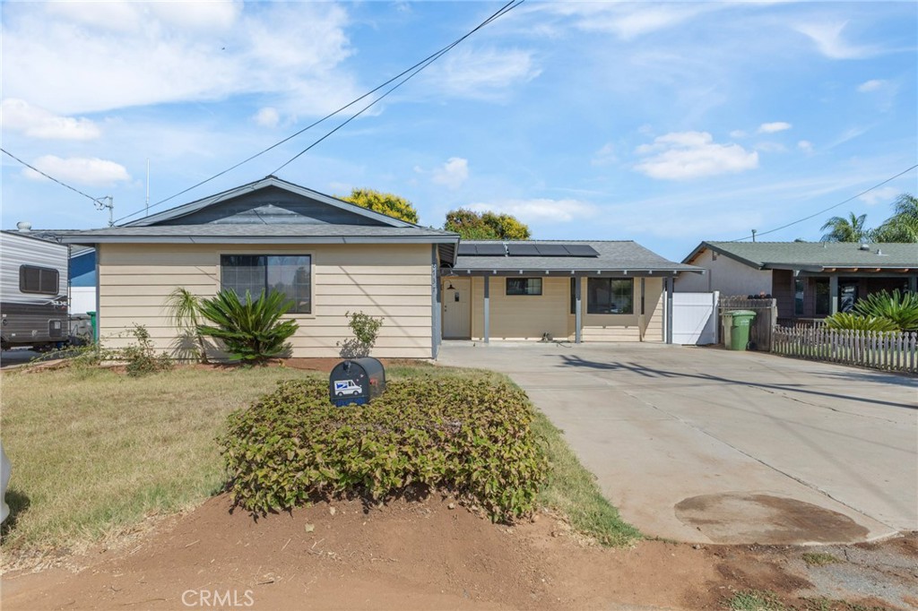 8737 Rhodes Court Santee, CA 92071 - Photo 4 of 30 a front view of a house with garden