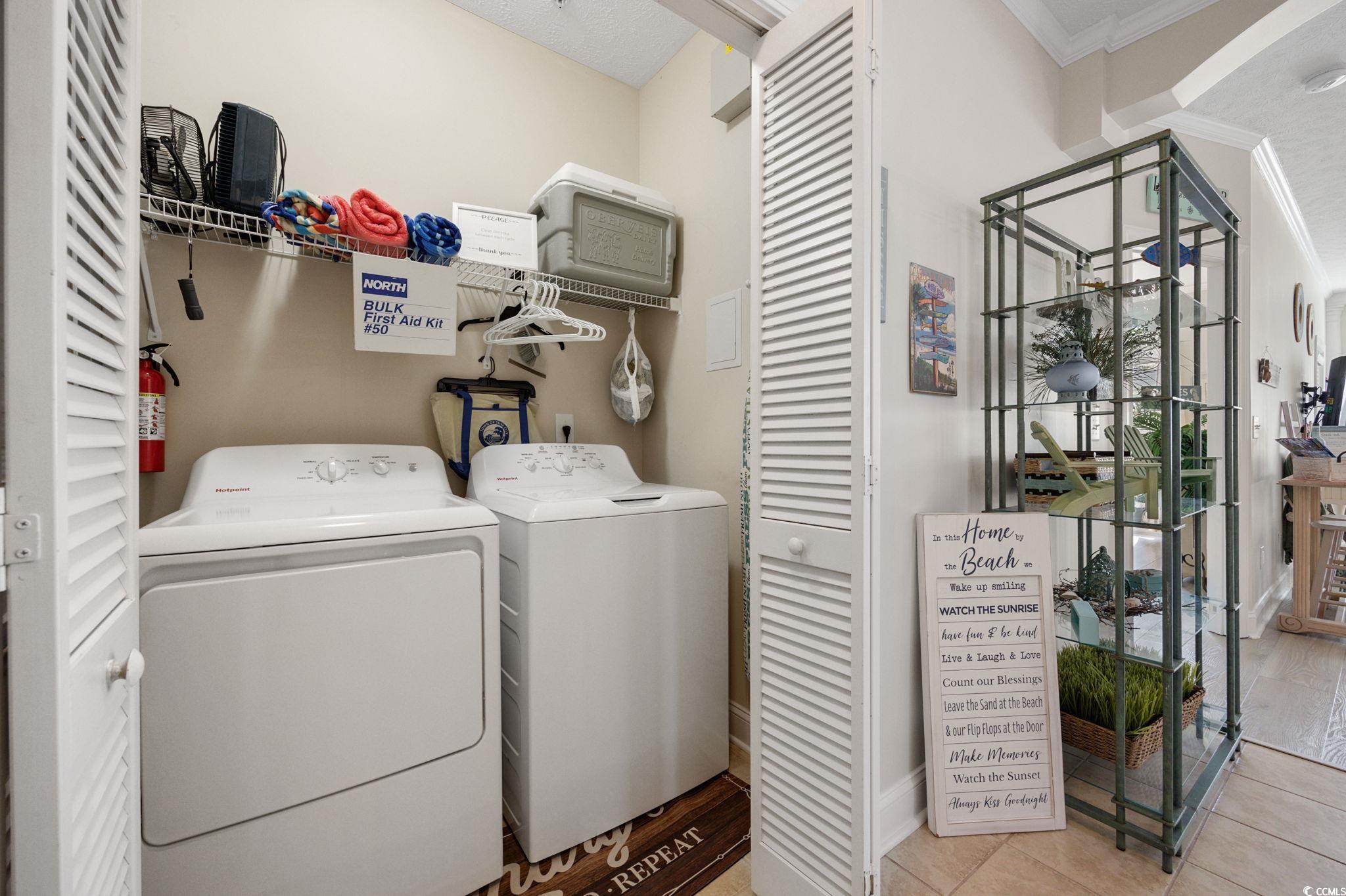 121 Waypoint Ridge Avenue, Unit P8 Little River, SC 29566 - Photo 25 of 40 Washroom with ornamental molding, light tile patterned floors, and separate washer and dryer