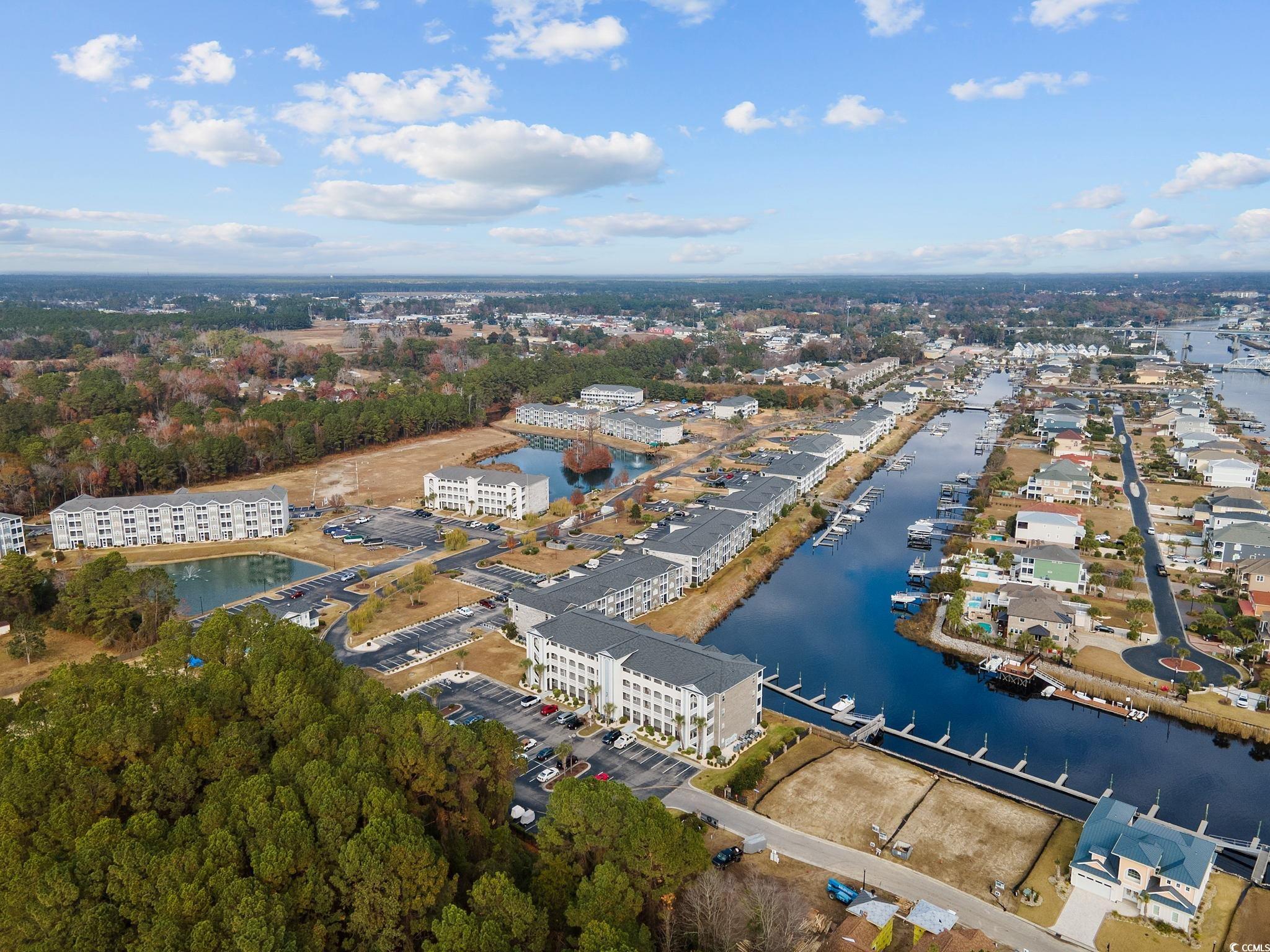 121 Waypoint Ridge Avenue, Unit P8 Little River, SC 29566 - Photo 30 of 40 Aerial view of property and surrounding area with a nearby body of water and apartment complex / building
