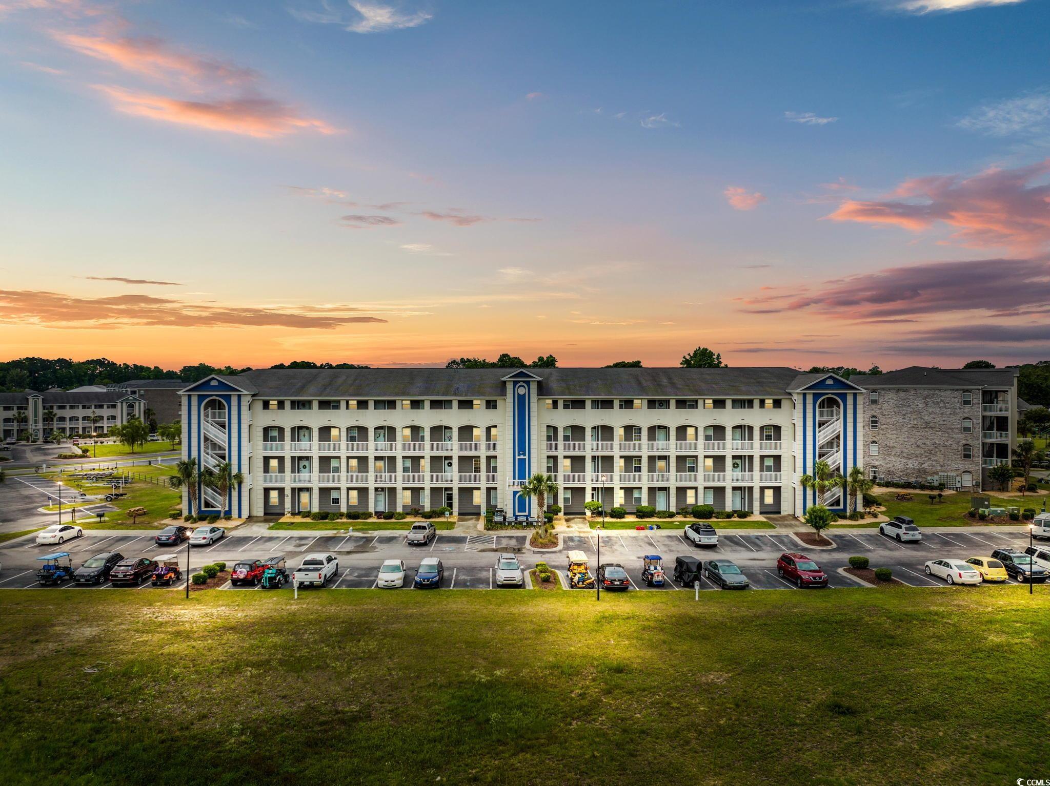 121 Waypoint Ridge Avenue, Unit P8 Little River, SC 29566 - Photo 31 of 40 Property at dusk with uncovered parking