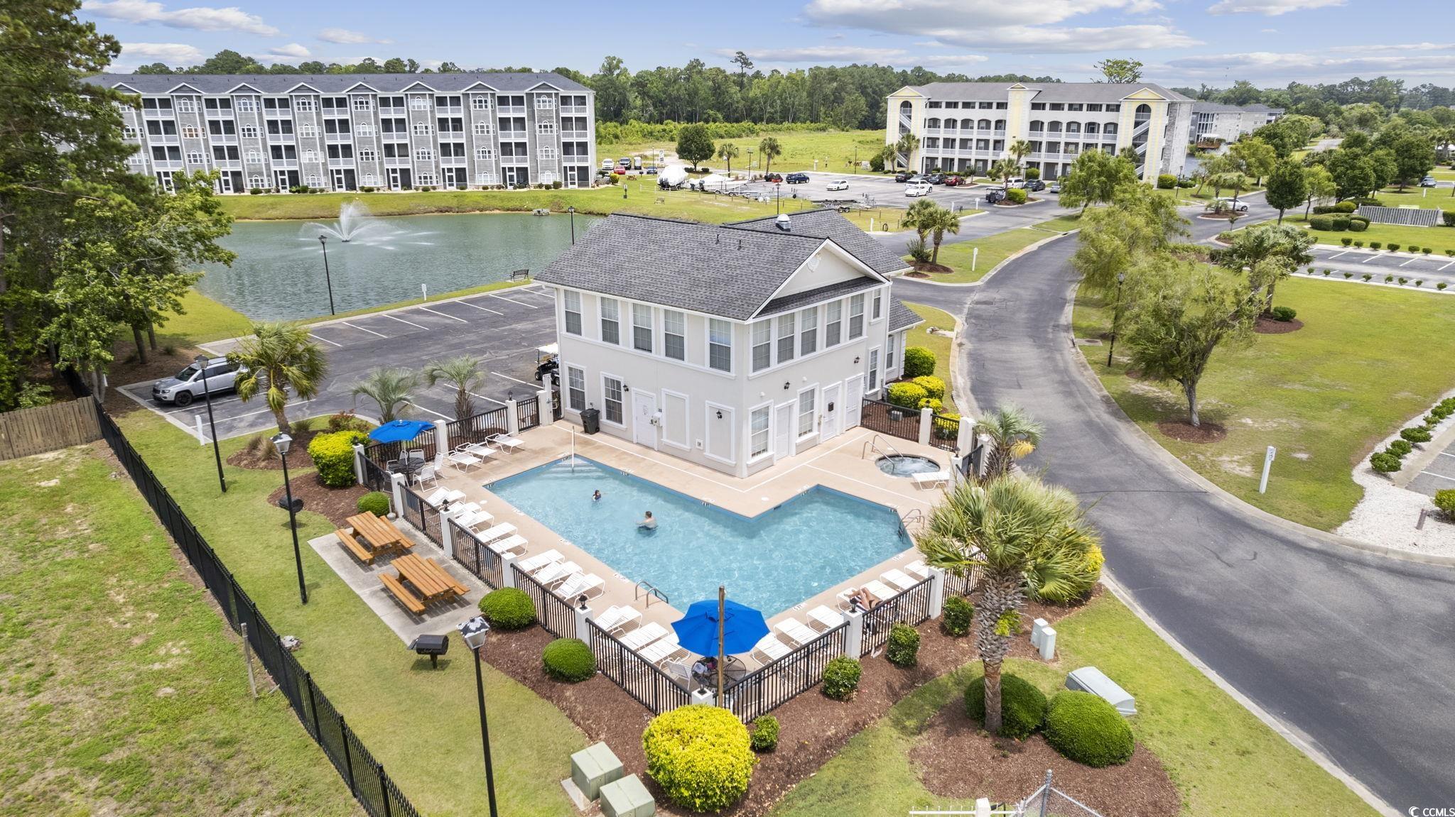 121 Waypoint Ridge Avenue, Unit P8 Little River, SC 29566 - Photo 32 of 40 Drone / aerial view of a large body of water and a pool area