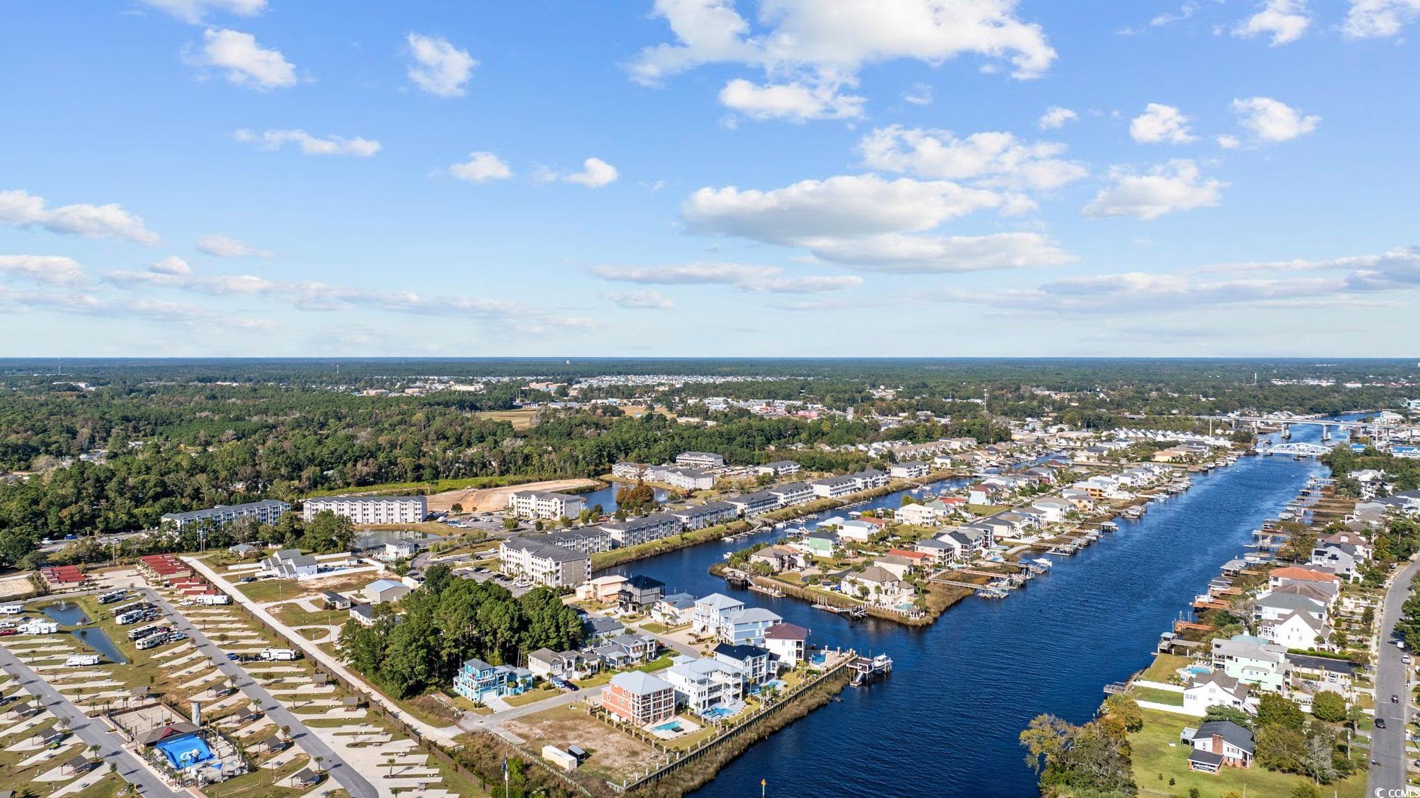 121 Waypoint Ridge Avenue, Unit P8 Little River, SC 29566 - Photo 39 of 40 Aerial view of residential area featuring a large body of water