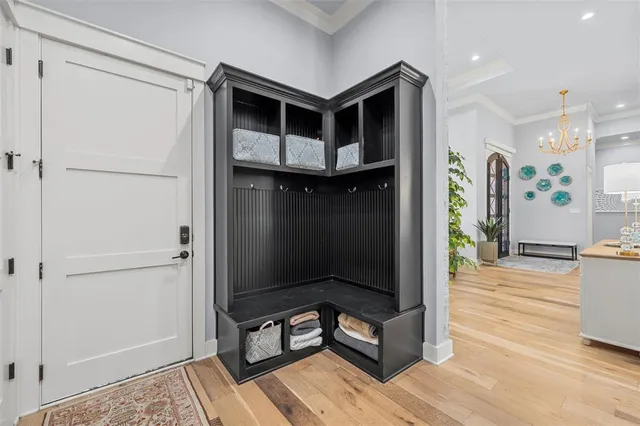 a living room with wooden floor and furniture