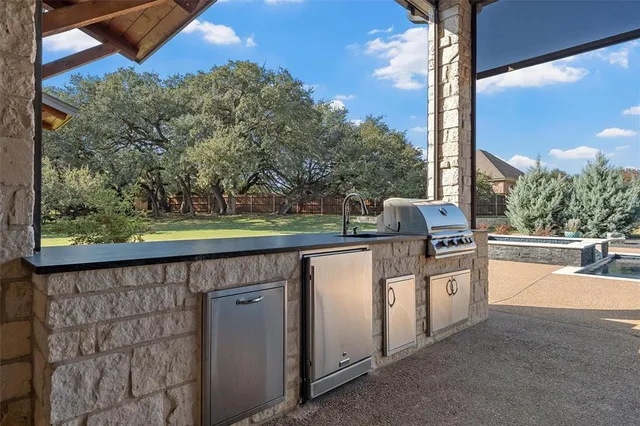 a kitchen with a sink and a stove