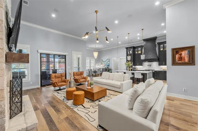 a living room with furniture kitchen view and a fireplace