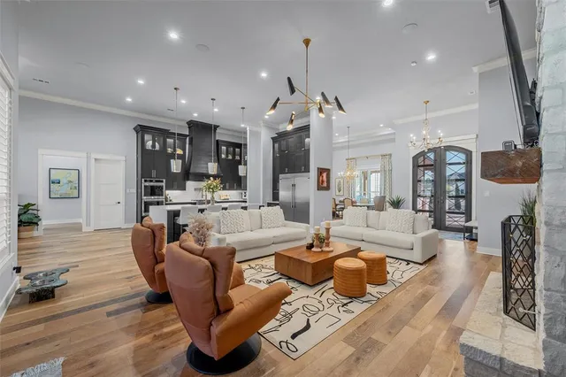 a living room with lots of furniture and kitchen view