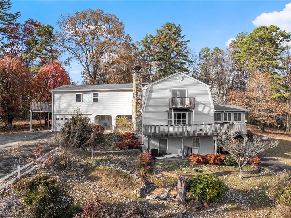 387 Smoke Rise Drive Sautee Nacoochee, GA 30571 - Photo 1 of 79 a front view of a house with garden