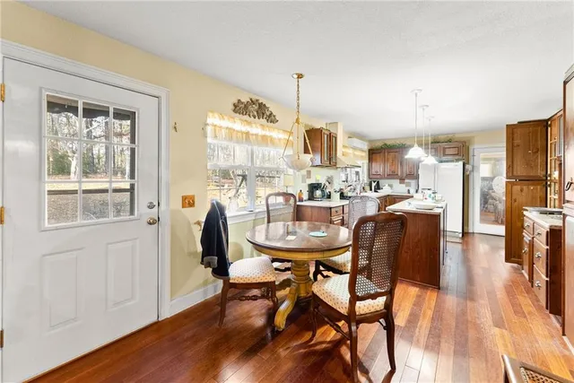 a bathroom with a sink mirror and toilet