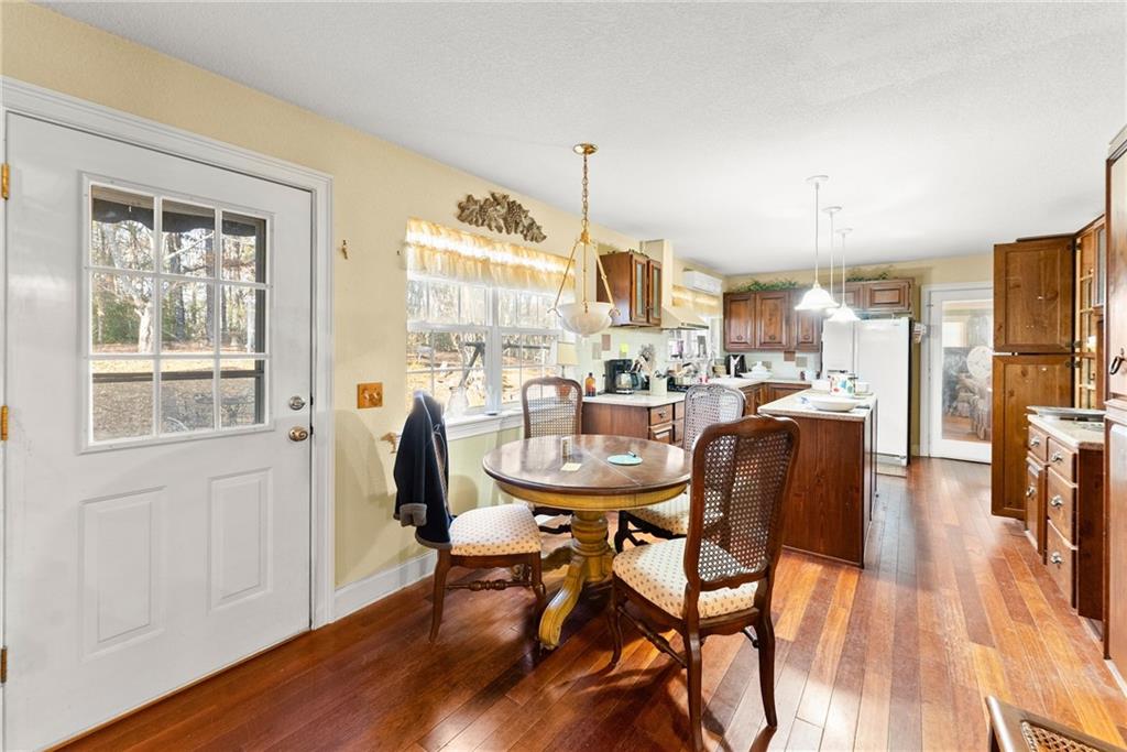 387 Smoke Rise Drive Sautee Nacoochee, GA 30571 - Photo 17 of 79 a dining room with furniture and wooden floor