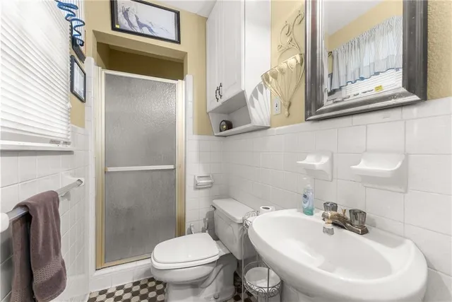 a bedroom with furniture and a chandelier