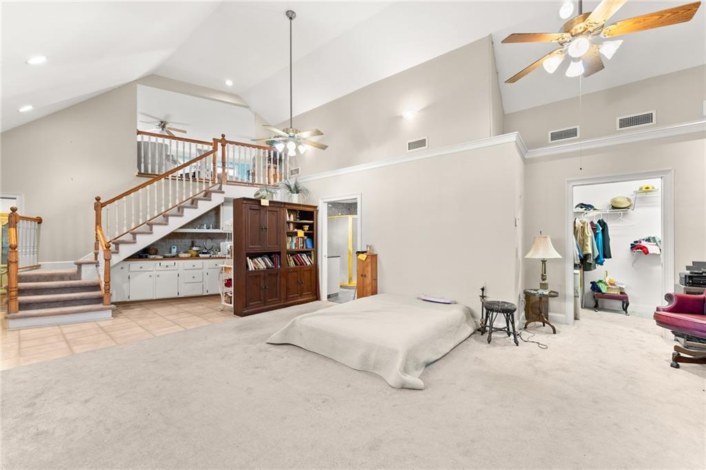 387 Smoke Rise Drive Sautee Nacoochee, GA 30571 - Photo 24 of 79 a bedroom with furniture and a chandelier