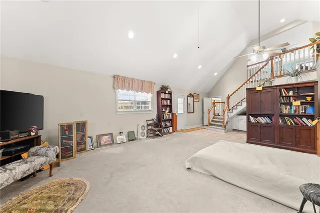 a bedroom with a bed and a couch