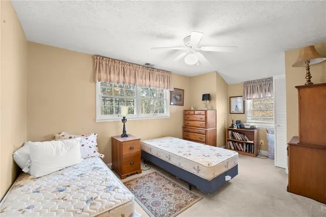 a very nice looking room with wooden floor and furniture