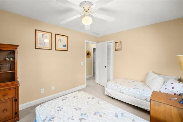 a view of a livingroom with furniture and a window
