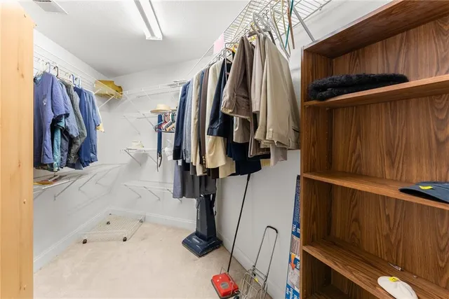 a view of a patio with table and chairs and potted plants