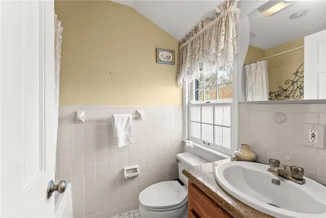 a view of a yard with wooden fence