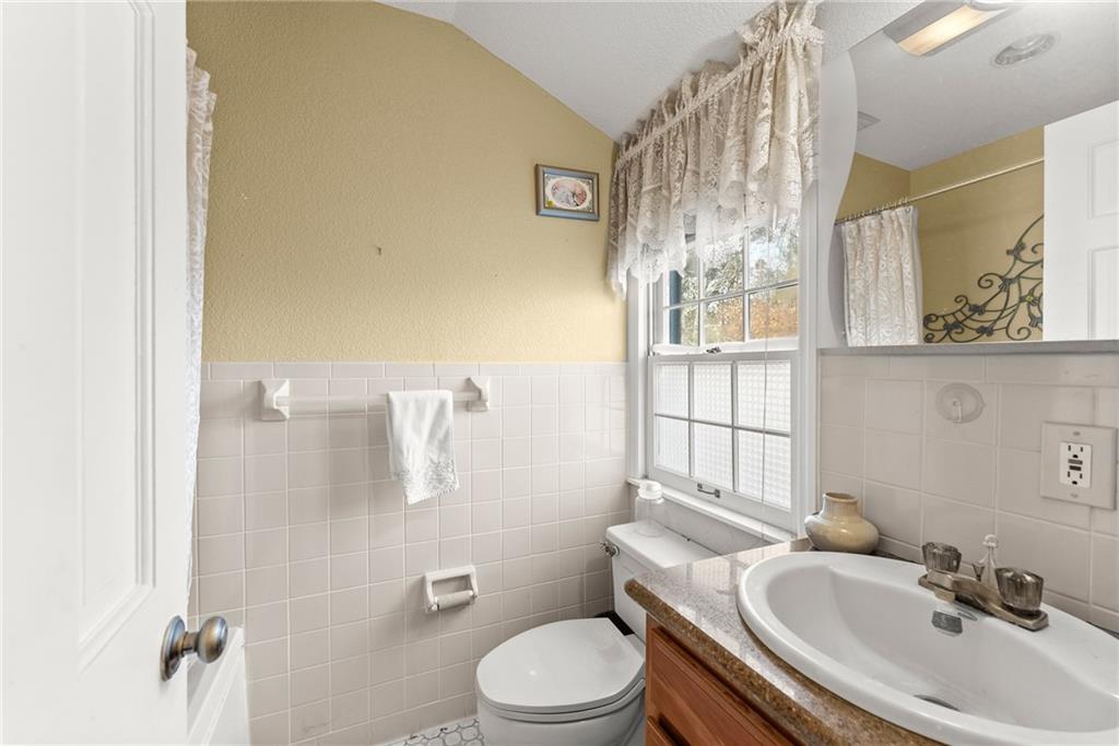 387 Smoke Rise Drive Sautee Nacoochee, GA 30571 - Photo 40 of 79 a white toilet sitting next to a bathroom sink