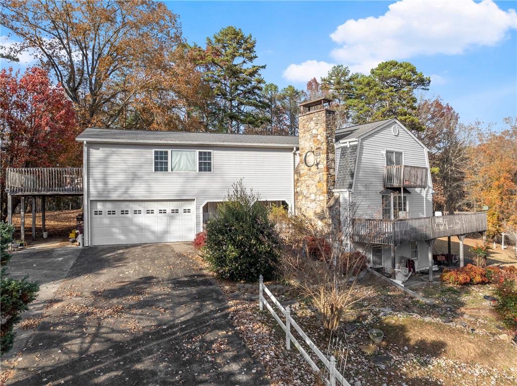 387 Smoke Rise Drive Sautee Nacoochee, GA 30571 - Photo 4 of 79 a view of a house with a yard and large trees