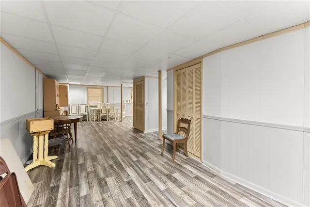 a big house with a large tree in front of it