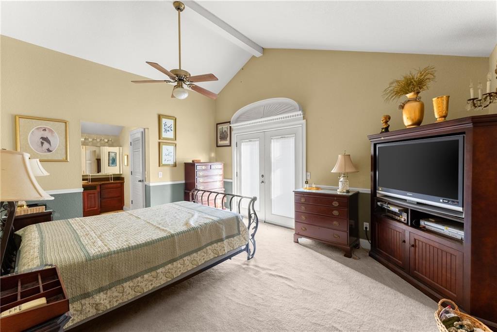 387 Smoke Rise Drive Sautee Nacoochee, GA 30571 - Photo 45 of 79 a living room with a bed and furniture flat screen tv