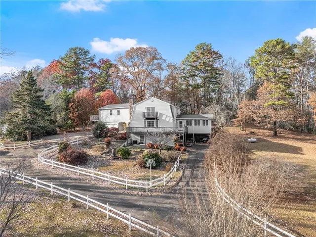 a view of a hallway view with floor to ceiling window and wooden floor