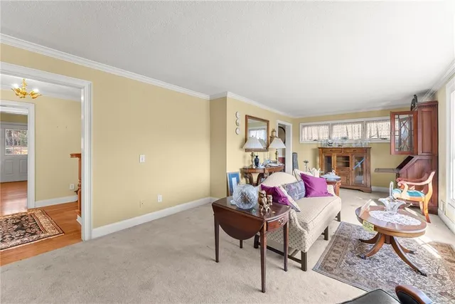 a view of a livingroom with furniture and window